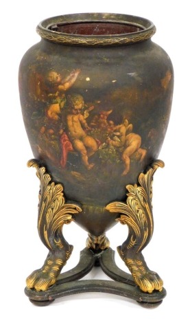 A Continental terracotta wood and composition floor vase, with a tin liner, painted with Old Master scenes of putti, flowers, etc., on parcel gilt supports with paw feet and triform base, 70cm high.