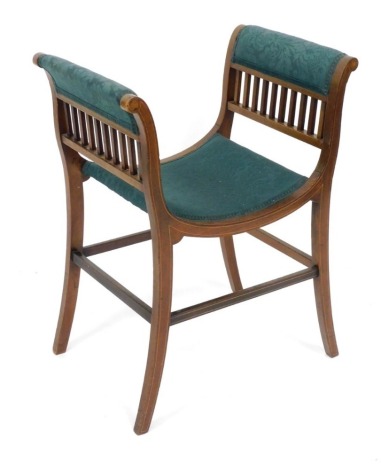 An Edwardian mahogany and boxwood strung stool, with padded arm rests and seat, on shaped legs.