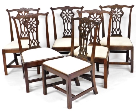 A set of six 19thC Chippendale style mahogany dining chairs , each with a pierced Gothic style splat, a drop in calico seat on chamfered legs with H stretcher.