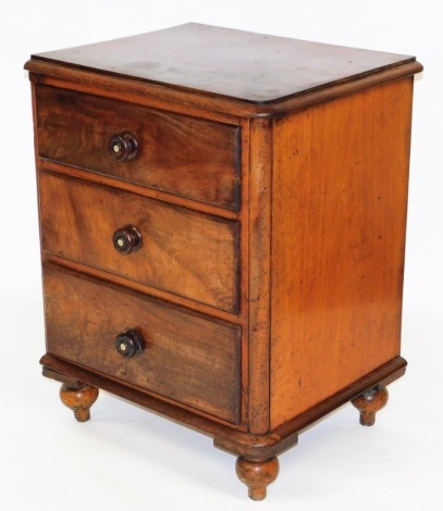 A Victorian flame mahogany pedestal chest, of three drawers, raised on turned feet, 87cm high, 64cm wide, 54cm deep. (AF)