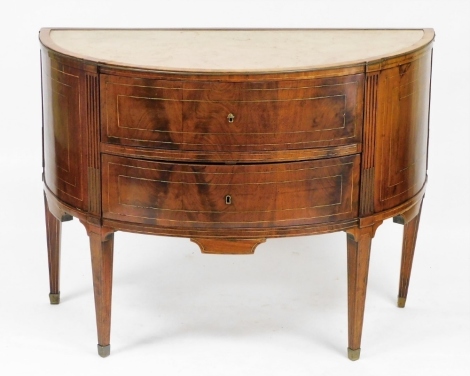 An Anglo Colonial style flame mahogany and marble topped bow fronted chest, of two drawers, raised on tapering square legs, brass capped, 89cm high, 120cm wide, 60cm deep.