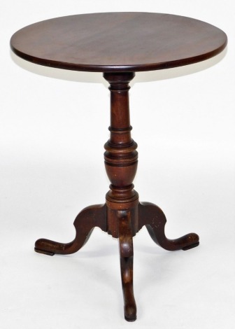 A George III mahogany occasional table, the circular top raised over a baluster turned column above three cabriole legs, 71cm high, 59cm wide.