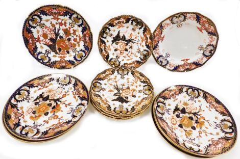 Twelve Royal Crown Derby porcelain Imari dinner and dessert plates, with gilt rims, printed marks.