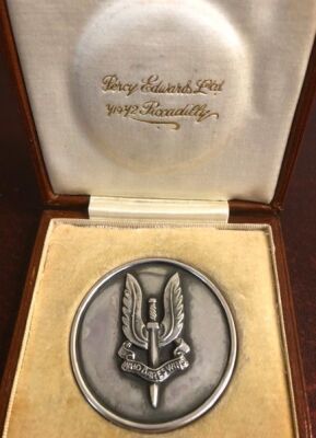 S.A.S. Interest. A circular medallion with the obverse cast SAS regimental badge with motto Who Dares Wins, verso scripted 'Given to Maj. Johnny Wiseman M.C. as a token of esteem for his courage & service in the war with Germany 1939-1945 from the Officer - 2