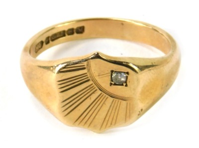 A 9ct gold signet ring, with an engraved quarter sunburst ring head, set with round brilliant cut tiny diamond, in four claw setting, ring size T, 5.9g all in.