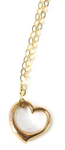 A 9ct gold pendant and chain, the heart shaped pendant on a fine fancy link neck chain, 50cm long, 1.8g all in.