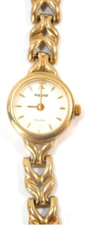 An Accurist gold lady's 9ct gold wristwatch, with circular watch head, on V splayed strap, 16cm long, 14.5g all in.