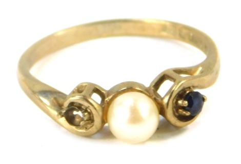 A 9ct gold dress ring, with central cultured pearl, flanked by sapphires, lacking stones to one side, size M 1/2, 1.9g all in.