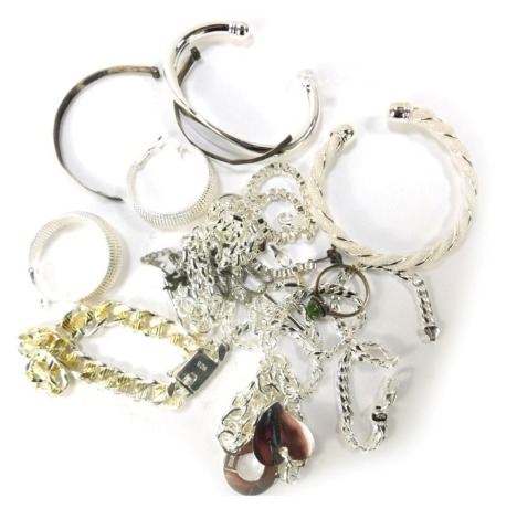 A small group of silver costume jewellery, comprising necklaces, bracelets, torc bangles, identity bracelets, etc. (a quantity)