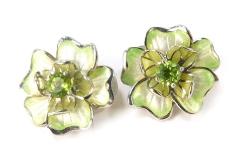 A pair of Nicole Bar silver and enamel peridot floral cluster earrings, each of two layer design with central peridot on clip backs, boxed.