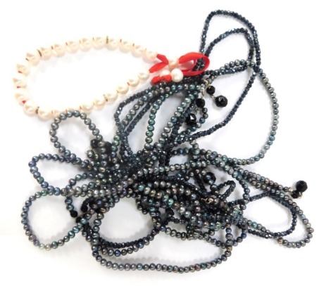 Two items of Claudia Bradbury jewellery, comprising a Claudia Bradbury Akira Tie multi strand necklace, and a Poppy Appeal cultured pearl bracelet, boxed. (2)