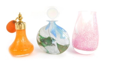 An iridescent mottled glass scent bottle, with clear stopper, 12cm high, a Caithness vase, and another scent bottle. (3)