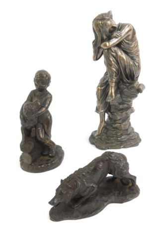 Three resin figurines, comprising a pensive lady seated on a rock, 25cm high, a young boy with a dog, and a figure of a Border Collie. (3)