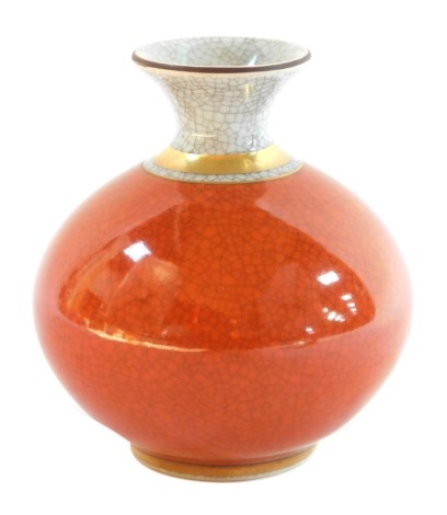 A Royal Copenhagen globular vase, with crackle glaze in orange, white within gilt borders, printed mark in green, typical wave mark and handwritten numbers 212/2353, 10cm high.