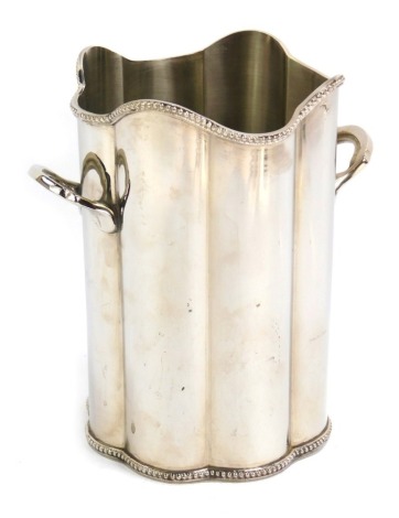 A silver plated twin handled wine bottle holder, of fluted form, with a beaded edge, stamped to underside, Solid Brass, 18cm high.