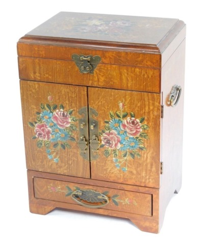 A Korean elm and painted tansu cabinet, with brass carrying handles, the hinged lid painted with roses and other flowers, above a pair of doors, similarly painted, enclosing three drawers, over a frieze drawer, raised on bracket feet., 28cm high, 28cm wid