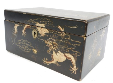 An early 20thC Japanese black lacquered cigarette box, painted with dragons, with steel lock plate, 10cm high, 20cm wide, 12cm deep.