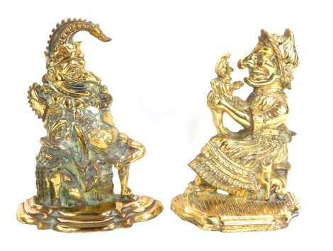 A pair of Victorian brass Punch and Judy door stops, 30cm high.