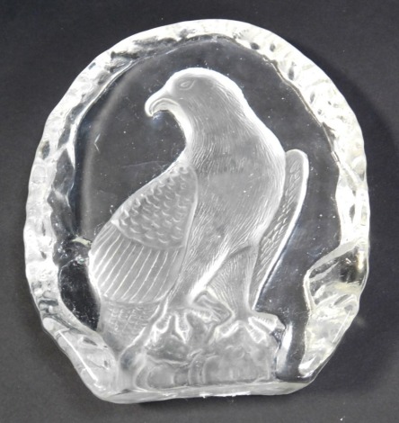 A glass paperweight, with an intaglio design of an eagle on rock, 15cm high.