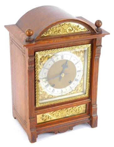 A 19thC oak ting tang mantel clock, by Winterhalder & Hoffmeier square brass dial with foliate spandrels, silvered chapter ring bearing Roman numerals, German eight day movement with coil strike, the cased or domed, architectural form, with pendulum and k