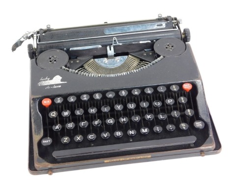 A Baby Deluxe cased vintage typewriter.