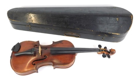 A two piece split back violin, bearing label for De Giovanni Paolo Grancinoro, Special Orchestra Violin, Fabricante Saxony, in a coffin case, 59cm long.