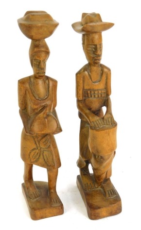 Two carved hardwood tribal figures, of lady and gentleman in standing pose, 28cm high.