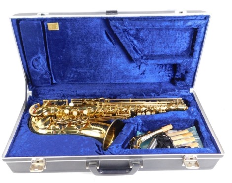 A Boosey & Hawkes 400 cased saxophone, with additional mouthpieces, the case 63cm wide, 28cm deep.