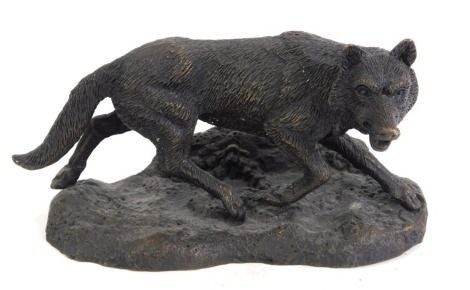 A bronze figure of a prowling fox, after Mene, 10cm high, 20cm wide.