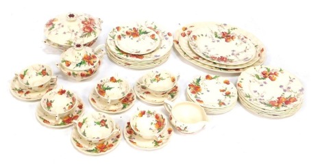 A Royal Doulton Sherborne pattern part dinner service, comprising three meat plates, large tureen and cover, soup ladle cover and spoon, six dinner plates, gravy boat, six two handled cups and saucers, six medium plates and six side plates.