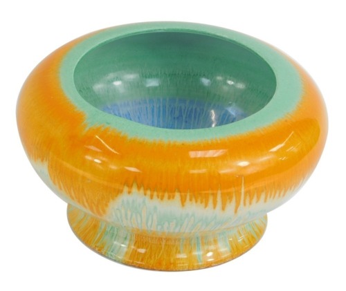 A Shelley drip glazed bowl, with green rim, orange and blue border, stamped Shelley England, 12cm high, 21cm wide.