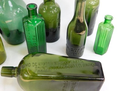 A collection of 19thC and later green glass bottles, comprising Low Sun and Cobbald Limited of Stamford, George Shaw and Co Limited Leigh Brewery, Green Poison bottle, another stamped Des Bauphins, JH Cuff Limited of Manchester, three unmarked green glass - 2