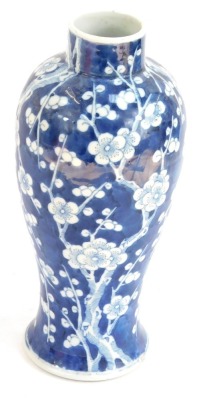 A Qing dynasty Chinese blue and white porcelain balaster vase, decorated with prunus blossom against a cracked ice ground, bears four character Kang-Hsi mark, 29cm high. (AF)