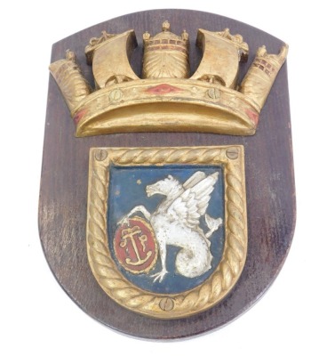 A gilt bronze ships plaque, the shield depicting a hippocampus with an oval shield with an anchor, with naval crown surmount, on an oak shield back, 29.5cm high.