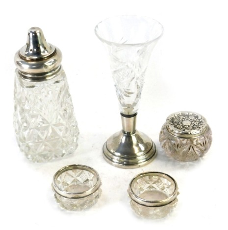 Silver and cut glass items, comprising a silver rimmed sugar shaker, silver topped small dressing table jar, salts, and a vase. (5)