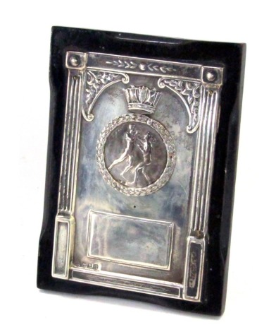 An Edward VII silver boxing trophy, the rectangular plate with medallion of two boxers, marked Philips, the rectangular Corinthian columned frame, lacking inscription, London 1907, with black ebonised framed base, 13cm x 9.5cm.