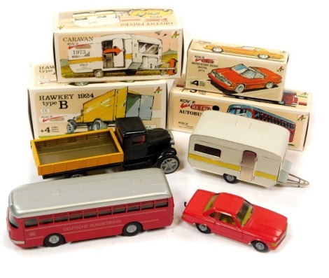 Kovap retro tin plate vehicles, including a Mercedes Benz 350 SL, Retro 1959 Autobus, Hawkey 1924 type B wagon, and a 1973 Caravan, boxed. (4)