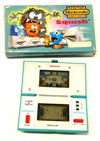 A Nintendo Squish pocket size game and watch, with outer box.