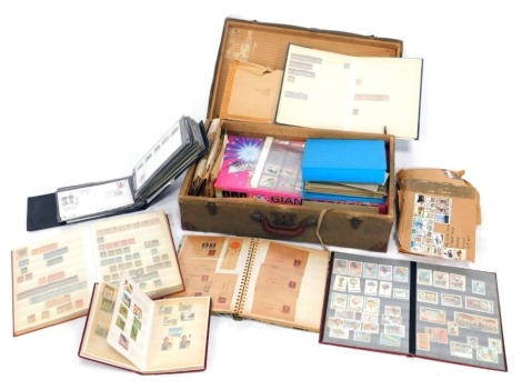 Philately. An album containing UK and World stamps, and a case of loose stamps and first day covers. (a quantity)