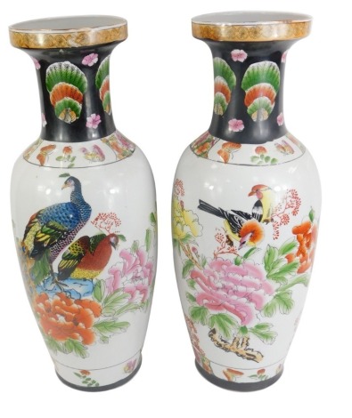 A pair of Chinese porcelain vases, of shouldered, tapering form, painted with birds and flowers, 62cm high.