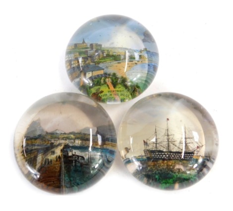 Three late Victorian glass paperweights, comprising one with HMS Victory Portsmouth, another marked Ventor from the West, and Ryde, Isle of Wight. (3)