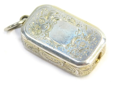 A Victorian silver vesta box, with cigar cutter, with floral and foliate engraved decoration, vacant shield reserve, Benjamin Barling London 1856, 15.3g.