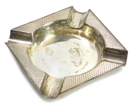 A George V silver ashtray, with engine turned decoration, Sheffield 1935, 2.57oz.