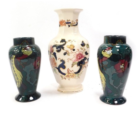 A Mason's Mandalay pattern ironstone vase, of octagonal form, 31cm high, and a pair of early 20thC Decoro vases painted with pheasants, stylised flowers and leaves against a pale blue ground, printed marks, 24cm high. (3)