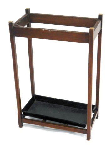 A Victorian mahogany stick and umbrella stand, of rectangular section, with a six division open base and metal drip tray, raised on square supports, 68cm high, 44.5cm wide, 25cm deep.