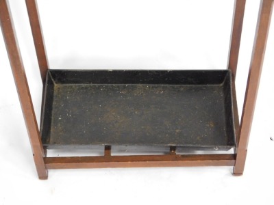 A Victorian mahogany stick and umbrella stand, of rectangular section, with a six division open base and metal drip tray, raised on square supports, 68cm high, 44.5cm wide, 25cm deep. - 2