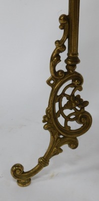 An early 20thC brass three tier plant stand, each tier with embossed bird foliate scroll decoration, raised on fluted columns and rococo style cabriole legs, 74cm high. - 3