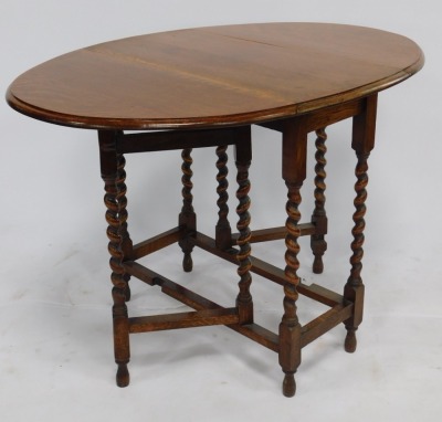 An early 20thC oak gate leg dining table, raised on barley twist supports, united by a box stretcher, 72cm high, 75cm wide, 39cm deep, 106cm extended. - 2