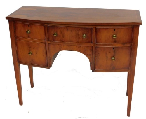 A Georgian reproduction bow front yew and burr yew sideboard, with boxwood line inlay, having a central drawer, flanked by two short over two deep drawers, raised on tapering square legs, 86cm high, 107cm wide, 45.5cm deep.