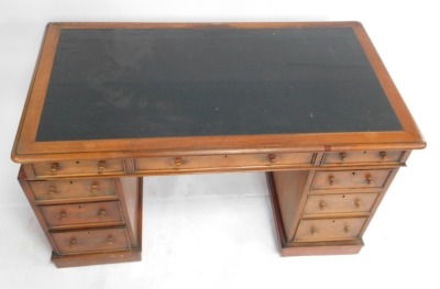 A Victorian mahogany twin pedestal desk, with a black leatherette top, over one long and eight short graduated drawers, raised on plinth bases, 79cm high, 136cm wide, 77cm deep. - 2